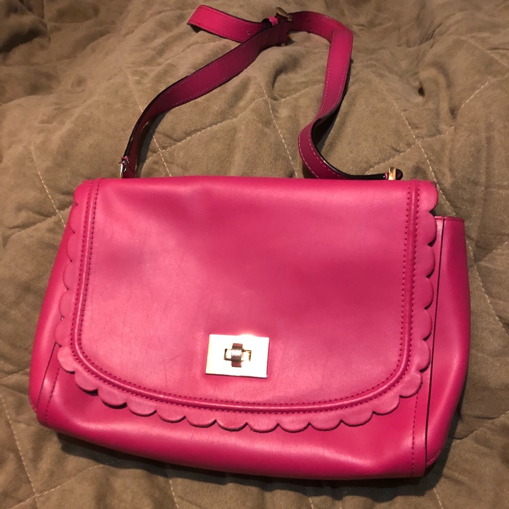 Small pink Kate Spade with scalloped edges.